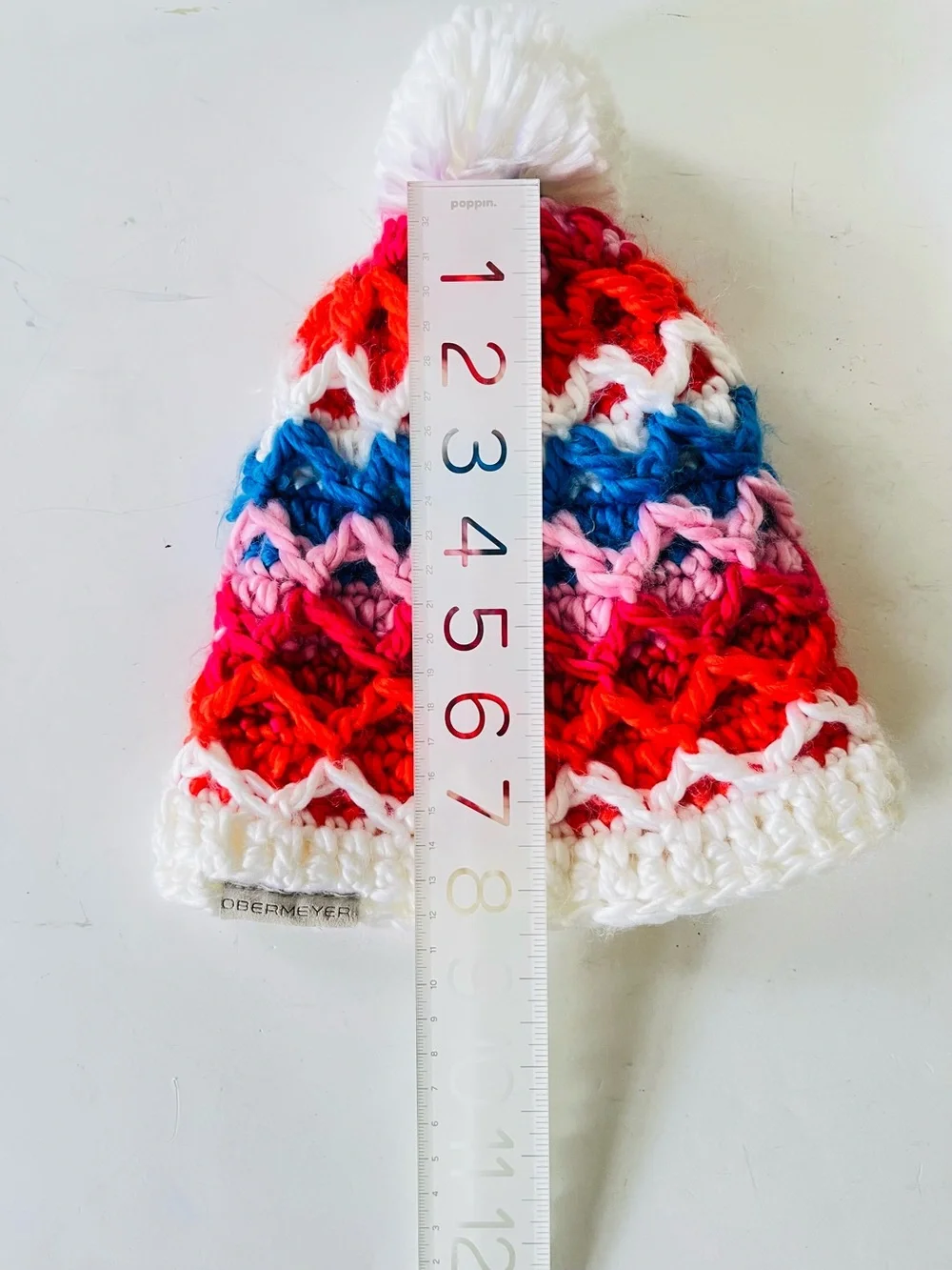 Obermeyer Teen  knit hat white blue red with pompom